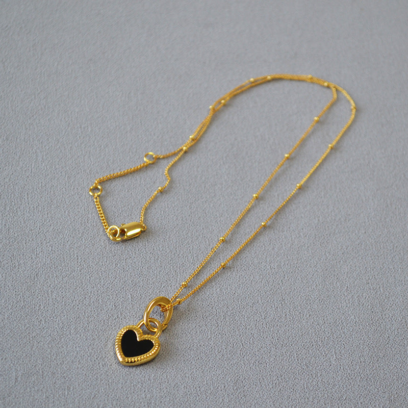 Gold Heart Pendant Necklace with Black and White Design