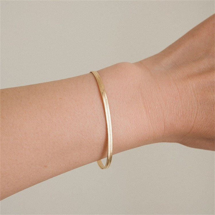 Elegant Herringbone Bracelet in Gold