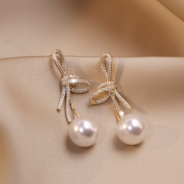 Gold Pearl Earrings with Sparkling Bow