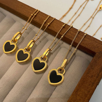 Gold Heart Pendant Necklace with Black and White Design