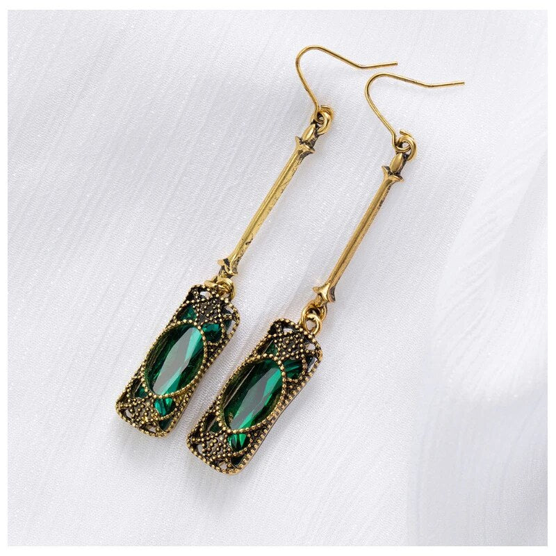 Gold Pendant Earrings with Green Lantern Design