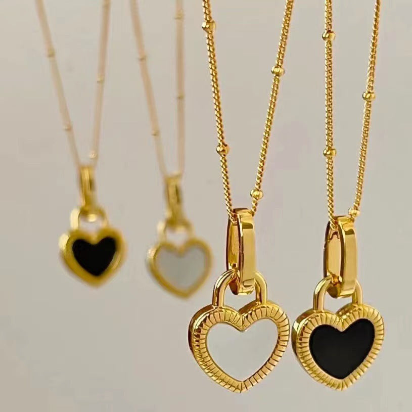 Gold Heart Pendant Necklace with Black and White Design