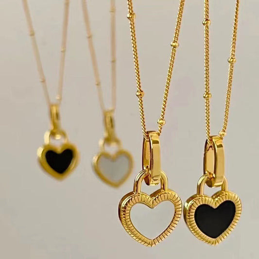 Gold Heart Pendant Necklace with Black and White Design