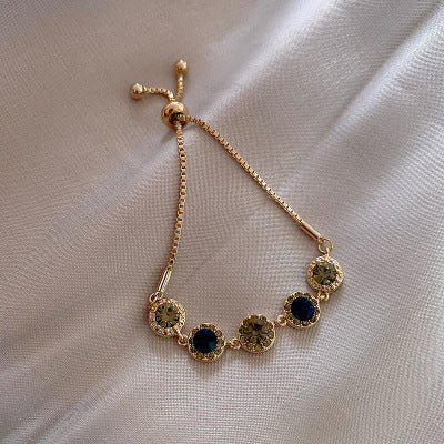 Gold Bracelet with Green Crystals
