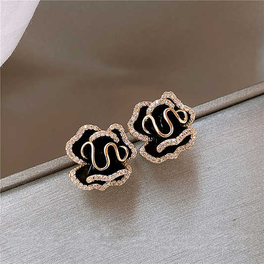 Chic Gold Earrings with Elegant Black Lotus Design